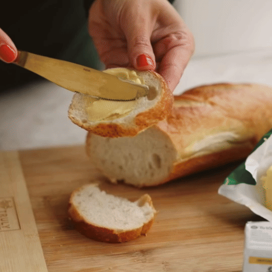 butter-ezgif.com-video-to-gif-converter (1) woman buttering bread